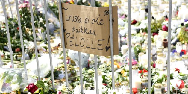 Candles, flowers and a placard reading 'There is no place for fear in Turku' have been left at the makeshift memorial for the victims of Friday's stabbings at the Turku Market Square, Finland on August 20, 2017.
Ten people were stabbed in Central Turku on August 18, 2017 and two persons have been confirmed dead. / AFP PHOTO / Lehtikuva / Vesa Moilanen / Finland OUT (Photo credit should read VESA MOILANEN/AFP/Getty Images)