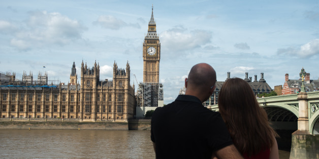 A couple hug agains the backdrop of the Elizabeth Tower, known as 'Big Ben' and the Houses of Parliament, in London on August 14, 2017. The bongs of the iconic bell will be stopped to protect workers during a four-year, £29m-conservation project that includes repair of the Queen Elizabeth Tower, which houses the Great Clock and its bell. The familiar bongs will fall silent after sounding at noon 21 August, and are set to begin again regularly in 2021. (Photo by Alberto Pezzali/NurPhoto via Ge