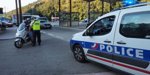 French police officers control vehicles coming across the border from Spain near Le Perthus, southern France, on August 18, 2017, following two quick-succession, separate attacks in Barcelona and another in the popular Spanish seaside city Cambrils, leaving 13 people dead and injuring more than 100 others.
In the first incident, which was claimed by the Islamic State group, a white van sped into a street packed full of tourists in central Barcelona on August 17, knocking people out of the way and killing 13. The driver stepped out of the van and fled the scene. Some eight hours later in Cambrils, a city 120 kilometres south of Barcelona, an Audi A3 car rammed into pedestrians, injuring six civilians -- one of them critically -- and a police officer. / AFP PHOTO / RAYMOND ROIG (Photo credit should read RAYMOND ROIG/AFP/Getty Images)