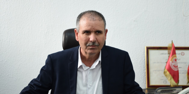 The new general secretary of the General Union of Tunisian Workers 'UGTT', Noureddine Taboubi, poses for photographers on the first day of taking his new office at the headquarters of the UGTT on January 30, 2017 in Tunis.
Tunisia's UGTT labour union, which played a role in the 2011 uprising that toppled the country's longtime dictator and its post-revolt transition, elected Taboubi on January 26.
/ AFP / FETHI BELAID (Photo credit should read FETHI BELAID/AFP/Getty Images)