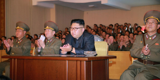 This picture taken on August 14, 2017 and released from North Korea's official Korean Central News Agency (KCNA) on August 15, 2017 shows North Korean leader Kim Jong-Un (C) clapping hands while viewing a stage during his inspecting the Command of the Strategic Force of the Korean People's Army (KPA) at an undisclosed location. North Korean leader Kim Jong-Un said on August 15 he would hold off on a planned missile strike near Guam, but warned the highly provocative move would go ahead in the ev