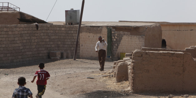 A man holds a mortar shell after he found it east of Mosul, Iraq August 16, 2017. Picture taken August 16, 2017. REUTERS/Azad Lashkari