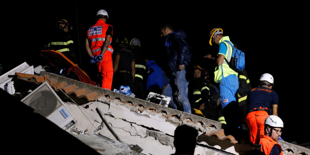 Rescue workers check a collapsed house after an earthquake hits the island of Ischia, off the coast of Naples, Italy August 22, 2017. REUTERS/Ciro De Luca