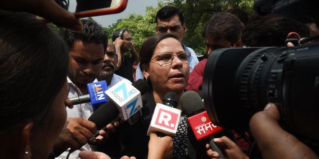 Indian Supreme Court advocate Farha Faiz (C) speaks to the media outside the Supreme Court in New Delhi on August 22, 2017.India's top court on August 22 banned a controversial Islamic practice that allows men to divorce their wives instantly, ending a long tradition that many Muslim women had fiercely opposed. / AFP PHOTO / Money SHARMA (Photo credit should read MONEY SHARMA/AFP/Getty Images)
