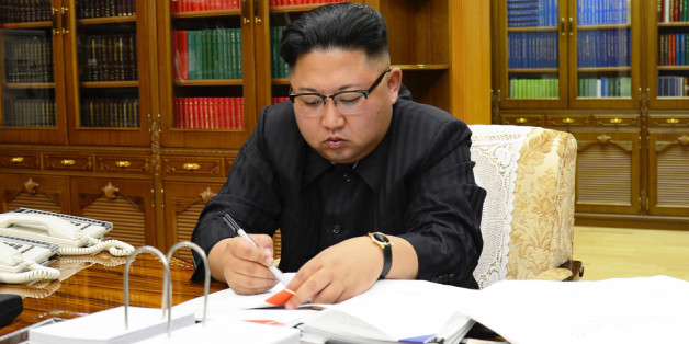 This picture from North Korea's official Korean Central News Agency (KCNA) taken on July 3, 2017 and released on July 4, 2017 shows North Korean leader Kim Jong-Un signing the order to carry out the test-fire of the intercontinental ballistic missile Hwasong-14 at an undisclosed location.North Korea declared on July 4 it had successfully tested its first intercontinental ballistic missile -- a watershed moment in its push to develop a nuclear weapon capable of hitting the mainland United States.