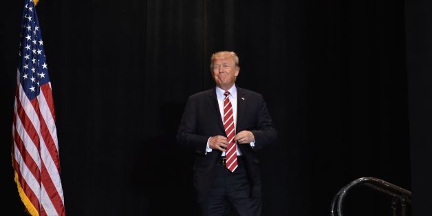 US President Donald Trump arrives to speak at a 'Make America Great Again' rally in Phoenix, Arizona, on August 22, 2017. / AFP PHOTO / Nicholas Kamm (Photo credit should read NICHOLAS KAMM/AFP/Getty Images)