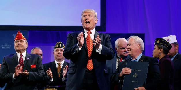 U.S. President Donald Trump applauds after signing the Veterans Appeals Improvement and Modernization Act during the American Legion National Convention in Reno, Nevada, U.S., August 23, 2017. REUTERS/Joshua Roberts