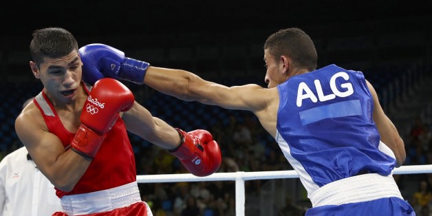 2016 Rio Olympics - Boxing - Preliminary - Men's Fly (52kg) Round of 16 Bout 207 - Riocentro - Pavilion 6 - Rio de Janeiro, Brazil - 15/08/2016. Daniel Asenov (BUL) of Bulgaria and Mohamed Flissi (ALG) of Algeria compete. REUTERS/Yves Herman FOR EDITORIAL USE ONLY. NOT FOR SALE FOR MARKETING OR ADVERTISING CAMPAIGNS.