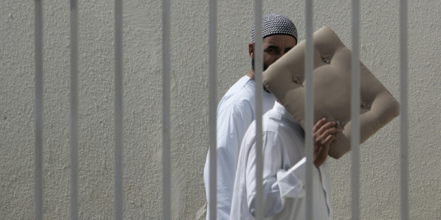 Suspects arrive for a trial in Sale, near Rabat June 29, 2007. Over 50 suspected members of extremist Islamist group Ansar al Mehdi are being tried in a mass trial for planning to overthrow Morocco's monarchy and establish an Islamic republic . REUTERS/Rafael Marchante (MOROCCO)