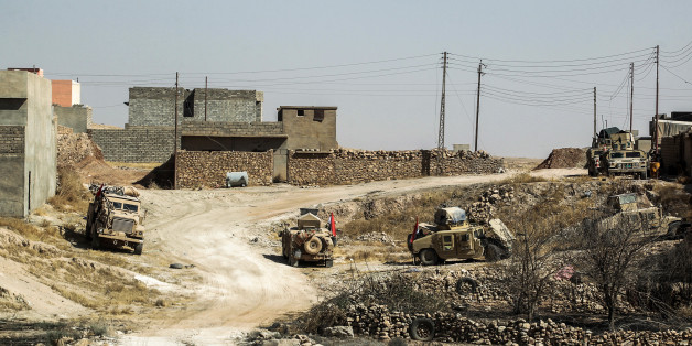 Humvees of the combined Iraqi forces and Hashed Al-Shaabi (Popular Mobilization units) advance inside the town of Tal Afar, west of Mosul, after the Iraqi government announced the launch of the operation to retake it from Islamic State (IS) group control, on August 25, 2017. / AFP PHOTO / AHMAD AL-RUBAYE (Photo credit should read AHMAD AL-RUBAYE/AFP/Getty Images)