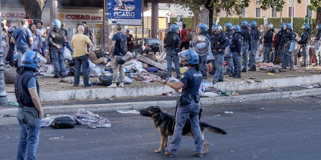 ROME, ITALY - AUGUST 24: The police evict refugees who camped in Piazza Indipendenza Gardens after their eviction from an occupied building in Piazza Indipendenza, on August 24, 2017 in Rome, Italy. From Saturday about 200 immigrants, all with regular residence permits and with the status of refugee and Prevenienti from Eritrea and Ethiopia, have camped in the street waiting to understand what will now be their destiny. About a hundred remain, including vulnerable families. The United Nations Hi