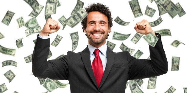 Happy man enjoying the rain of money