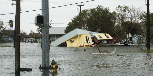 Flooding and a damaged home are seen after Hurricane Harvey hit Rockport, Texas, U.S., on Saturday, Aug. 26, 2017. As Harvey's winds die down, trouble for Texas has just begun as days of flooding rains across the heart of U.S. energy production threaten the country's fourth-largest city and leave farmers struggling to save horses, cows and crops. Photographer: Alex Scott/Bloomberg via Getty Images