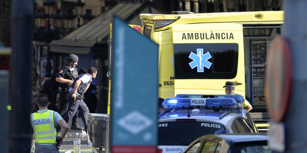 Armed policemen arrive in a cordoned off area after a van ploughed into the crowd, injuring several persons on the Rambla in Barcelona on August 17, 2017.
Police in Barcelona said they were dealing with a 'terrorist attack' after a vehicle ploughed into a crowd of pedestrians on the city's famous Las Ramblas boulevard on August 17, 2017. Police were clearing the area after the incident, which has left a number of people injured. / AFP PHOTO / Josep LAGO (Photo credit should read JOSEP LAGO/AFP/Getty Images)