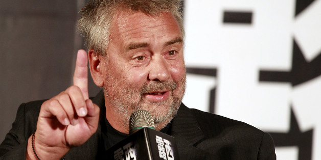 French film director Luc Besson gestures while answering a question during a news conference to promote his latest movie "Lucy" in Taipei August 19, 2014. Besson, whose new film "Lucy" is about a woman who ingests a drug that gives her supernormal mental powers, says action films bore him - but his movie still has a spectacular car chase through Paris. REUTERS/Pichi Chuang (TAIWAN - Tags: ENTERTAINMENT)