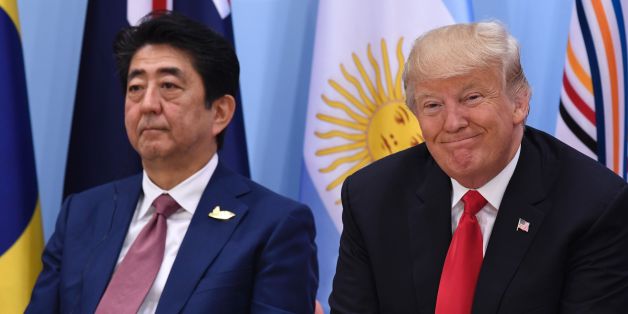 US President Donald Trump (R) and Japan's Prime Minister Shinzo Abe attend the panel discussion 'Launch Event Women's Entrepreneur Finance Initiative' on the second day of the G20 Summit in Hamburg, Germany, July 8, 2017.Leaders of the world's top economies gather from July 7 to 8, 2017 in Germany for likely the stormiest G20 summit in years, with disagreements ranging from wars to climate change and global trade. / AFP PHOTO / SAUL LOEB (Photo credit should read SAUL LOEB/AFP/Getty Imag