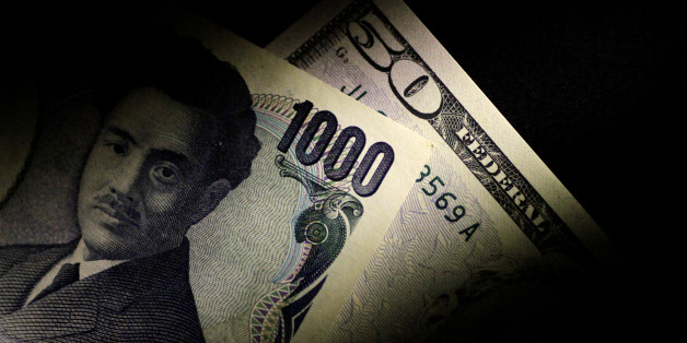 Japan Yen and U.S. Dollar notes are seen in this June 22, 2017 illustration photo. REUTERS/Thomas White/Illustration