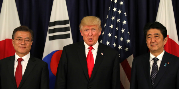 U.S. President Donald Trump meets South Korea's President Moon Jae-In and Japanese Prime Minister Shinzo Abe ahead the G20 leaders summit in Hamburg, Germany July 6, 2017. REUTERS/Carlos Barria