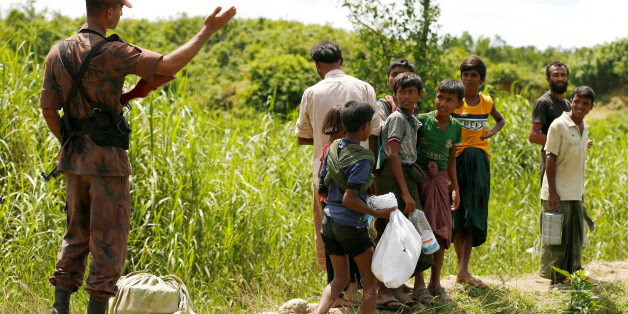 Members of Border Guard Bangladesh (BGB) stops Rohingya people who are trying to enter Bangladesh in Coxâs Bazar, Bangladesh, August 27, 2017. REUTERS/Mohammad Ponir Hossain