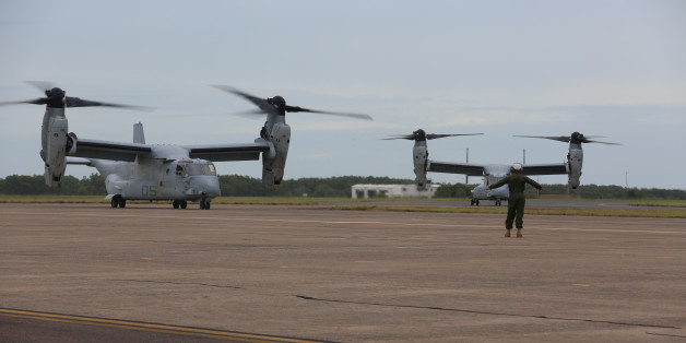A U.S. Marine guides an MV-22B Osprey into position after the aircraft landed at Royal Australian Air Force Base Darwin, Australia on April 28, 2017. Picture taken on April 28, 2017. Courtesy Damion Hatch/U.S. Marine Corps/Handout via REUTERS ATTENTION EDITORS - THIS IMAGE WAS PROVIDED BY A THIRD PARTY.