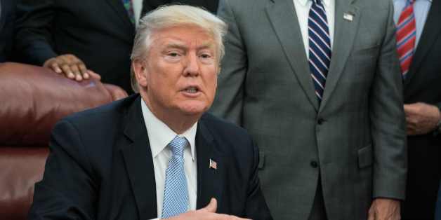 US President Donald Trump speaks to the press after signing a proclamation calling for a national day of prayer on September 3 for those affected by Hurricane Harvey in the Oval Office at the White House in Washington, DC, on September 1, 2017. / AFP PHOTO / NICHOLAS KAMM (Photo credit should read NICHOLAS KAMM/AFP/Getty Images)