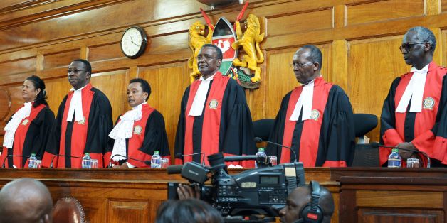 Judges stand to deliver their verdict at the Supreme Court in Nairobi on September 1, 2017, ordering a new presidential election within 60 days after cancelling after cancelling the results of last month's poll. Kenya's Supreme Court nullified President Uhuru Kenyatta's election win last month and called for new elections within 60 days. / AFP PHOTO / SIMON MAINA (Photo credit should read SIMON MAINA/AFP/Getty Images)