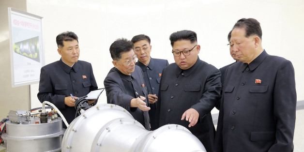 This undated picture released by North Korea's official Korean Central News Agency (KCNA) on September 3, 2017 shows North Korean leader Kim Jong-Un (C) looking at a metal casing with two bulges at an undisclosed location.
North Korea has developed a hydrogen bomb which can be loaded into the country's new intercontinental ballistic missile, the official Korean Central News Agency claimed on September 3. Questions remain over whether nuclear-armed Pyongyang has successfully miniaturised its weapons, and whether it has a working H-bomb, but KCNA said that leader Kim Jong-Un had inspected such a device at the Nuclear Weapons Institute. / AFP PHOTO / KCNA VIA KNS / STR / South Korea OUT / REPUBLIC OF KOREA OUT ---EDITORS NOTE--- RESTRICTED TO EDITORIAL USE - MANDATORY CREDIT 'AFP PHOTO/KCNA VIA KNS' - NO MARKETING NO ADVERTISING CAMPAIGNS - DISTRIBUTED AS A SERVICE TO CLIENTS
THIS PICTURE WAS MADE AVAILABLE BY A THIRD PARTY. AFP CAN NOT INDEPENDENTLY VERIFY THE AUTHENTICITY, LOCATION, DATE AND CONTENT OF THIS IMAGE. THIS PHOTO IS DISTRIBUTED EXACTLY AS RECEIVED BY AFP. / (Photo credit should read STR/AFP/Getty Images)