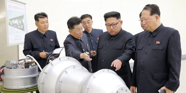 TOPSHOT - This undated picture released by North Korea's official Korean Central News Agency (KCNA) on September 3, 2017 shows North Korean leader Kim Jong-Un (C) looking at a metal casing with two bulges at an undisclosed location.
North Korea has developed a hydrogen bomb which can be loaded into the country's new intercontinental ballistic missile, the official Korean Central News Agency claimed on September 3. Questions remain over whether nuclear-armed Pyongyang has successfully miniaturised its weapons, and whether it has a working H-bomb, but KCNA said that leader Kim Jong-Un had inspected such a device at the Nuclear Weapons Institute. / AFP PHOTO / KCNA VIA KNS / STR / South Korea OUT / REPUBLIC OF KOREA OUT ---EDITORS NOTE--- RESTRICTED TO EDITORIAL USE - MANDATORY CREDIT 'AFP PHOTO/KCNA VIA KNS' - NO MARKETING NO ADVERTISING CAMPAIGNS - DISTRIBUTED AS A SERVICE TO CLIENTS
THIS PICTURE WAS MADE AVAILABLE BY A THIRD PARTY. AFP CAN NOT INDEPENDENTLY VERIFY THE AUTHENTICITY, LOCATION, DATE AND CONTENT OF THIS IMAGE. THIS PHOTO IS DISTRIBUTED EXACTLY AS RECEIVED BY AFP. / (Photo credit should read STR/AFP/Getty Images)