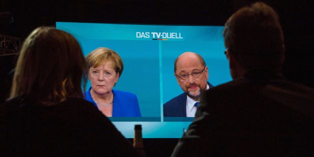 Journalists watch a televised debate between German Chancellor and leader of the conservative Christian Democratic Union (CDU) party Angela Merkel and Martin Schulz, leader of Germany's social democratic SPD party and candidate for Chancellor at a television studio in Berlin on September 3, 2017.
Angela Merkel, Germany's cool and collected chancellor, is going head-to-head with her fiery challenger Martin Schulz in their only television debate before this month's general elections, in a crucial match that could sway millions of voters. / AFP PHOTO / John MACDOUGALL (Photo credit should read JOHN MACDOUGALL/AFP/Getty Images)