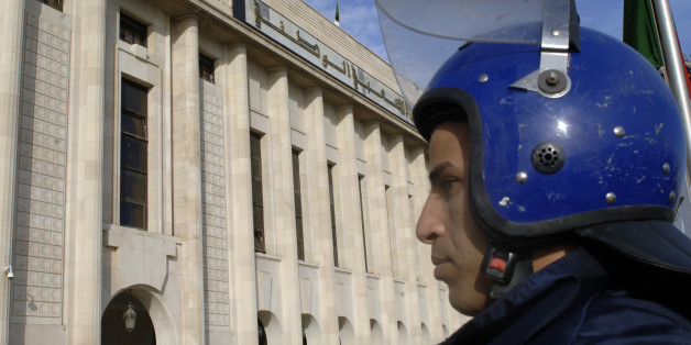 An Algerian policeman stands guard outside the People's National Assembly bulding in the capital Algiers on November 27, 2016. / AFP / RYAD KRAMDI (Photo credit should read RYAD KRAMDI/AFP/Getty Images)