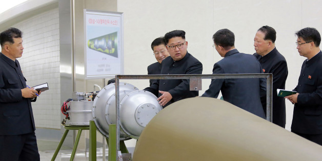 This undated picture released by North Korea's official Korean Central News Agency (KCNA) on September 3, 2017 shows North Korean leader Kim Jong-Un (C) looking at a metal casing with two bulges at an undisclosed location.
North Korea has developed a hydrogen bomb which can be loaded into the country's new intercontinental ballistic missile, the official Korean Central News Agency claimed on September 3. Questions remain over whether nuclear-armed Pyongyang has successfully miniaturised its weapons, and whether it has a working H-bomb, but KCNA said that leader Kim Jong-Un had inspected such a device at the Nuclear Weapons Institute. / AFP PHOTO / KCNA VIA KNS / STR / South Korea OUT / REPUBLIC OF KOREA OUT ---EDITORS NOTE--- RESTRICTED TO EDITORIAL USE - MANDATORY CREDIT 'AFP PHOTO/KCNA VIA KNS' - NO MARKETING NO ADVERTISING CAMPAIGNS - DISTRIBUTED AS A SERVICE TO CLIENTS
THIS PICTURE WAS MADE AVAILABLE BY A THIRD PARTY. AFP CAN NOT INDEPENDENTLY VERIFY THE AUTHENTICITY, LOCATION, DATE AND CONTENT OF THIS IMAGE. THIS PHOTO IS DISTRIBUTED EXACTLY AS RECEIVED BY AFP. / (Photo credit should read STR/AFP/Getty Images)
