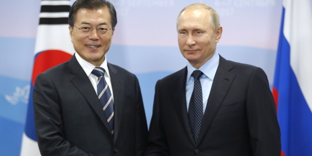 VLADIVOSTOK, RUSSIA - SEPTEMBER 6, 2017: South Korea's President Moon Jae-in (L) and Russia's President Vladimir Putin shake hands during a meeting as part of the 2017 Eastern Economic Forum at Far Eastern Federal University on Russky Island. Mikhail Metzel/TASS Host Photo Agency (Photo by Mikhail Metzel\TASS via Getty Images)