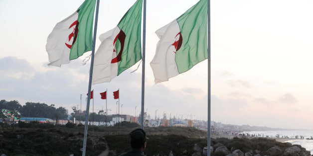 A soldier walks on the Algerian side of the Algeria-Morocco border as Algerian flags sway in the wind, near Tlemcen, at a border post in the Marsat Ben M'Hidi region, on July 14, 2011. Morocco's King Mohammed VI may be pressing hard for better relations with neighbouring Algeria and the re-opening of the border, but the unresolved Western Sahara question stands in the way of any real progress, analysts say. Morocco closed the border following a 1994 Islamist militant attack in Marrakesh, which i