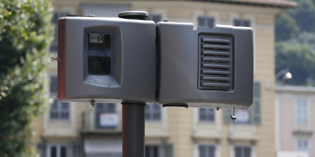 A new automatic traffic light radar is seen defaced on July 13, 2013 in Nice. The automatic radars check the speed of vehicles. AFP PHOTO / VALERY HACHE (Photo credit should read VALERY HACHE/AFP/Getty Images)