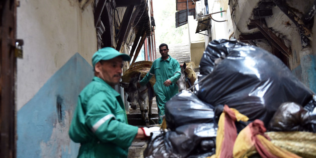 Garbage collectors lead donkeys in the old part of Algiers, known as the 'Kasbah', on May 22, 2017 as they collect the rubbish in the alleyways of this medina built during the 10th century under Zirid rule. It's a rubbish job, but someone has to do it. Or some animal: in the alleyways of Algiers' famed Kasbah, donkeys shift tonnes of trash every day. / AFP PHOTO / RYAD KRAMDI (Photo credit should read RYAD KRAMDI/AFP/Getty Images)