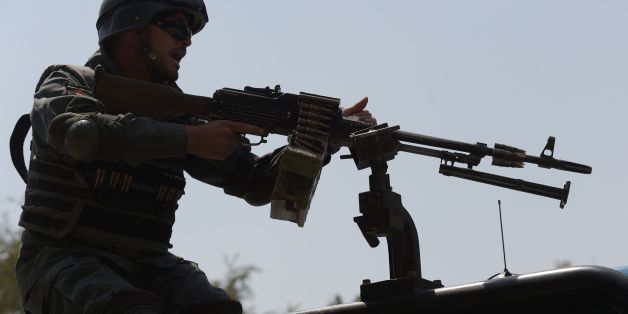 An Afghan policeman keeps watch at the site of a suicide attack outside a bank near the US embassy in Kabul on August 29, 2017.
A suicide bomber blew himself up on a busy shopping street near the US embassy in central Kabul on August 29, killing four people and injuring several others, officials said. It was the latest in a series of deadly attacks to hit the Afghan capital, and comes three months after a massive truck bomb ripped through the same area, killing about 150 people.
/ AFP PHOTO / SHAH MARAI (Photo credit should read SHAH MARAI/AFP/Getty Images)