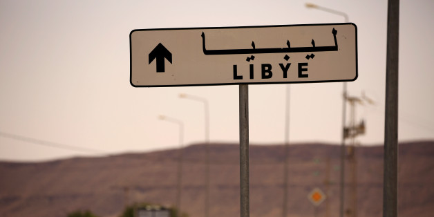 A road sign shows the direction of Libya near the border crossing at Dhiba, Tunisia April 11, 2016. Tunisia's 2011 uprising created fertile ground for jihadist recruiters. Hundreds of Islamist militants were freed from prison as part of an amnesty for those detained under Ben Ali. Ultra-conservative salafists began to flex their muscle, seizing control of mosques and clashing with secularists. As Tunisia's politics have stabilised, the government has reasserted control, taking back mosques, banning the local al Qaeda affiliate Ansar al Sharia, and forcing many militants to flee. At first the jihadists mostly headed to Syria. But now Libya is more popular with them - many Tunisians have become key figures in Islamic State there. In all, officials estimate that between 4,000-6,000 Tunisians have left to fight for Islamic State and other groups, among them university graduates and professionals recruited online. REUTERS/Zohra Bensemra SEARCH "ZOHRA REMADA" FOR THIS STORY. SEARCH "THE WIDER IMAGE" FOR ALL STORIES.
