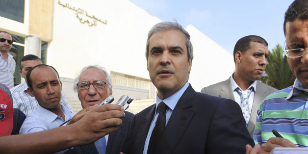 Prince Moulay Hicham, cousin of Morocco's King Mohammed VI, speaks to the press accompanied by his lawyer Abderrahim Berrada (centre L) after leaving the Ain Sebaa Court in Casablanca September 17, 2012. The Moroccan Prince has filed a lawsuit against Member of Parliament Abdelhadi Khairat on grounds of defamation. REUTERS/Macao (MOROCCO - Tags: ROYALS POLITICS CRIME LAW)