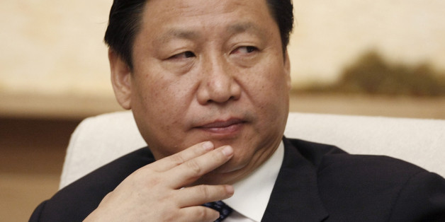 Shanghai Communist Party boss Xi Jinping attends Shanghai delegation discussion sessions of the 17th National Congress of the Communist Party of China in Beijing October 16, 2007. Married to a famous singer and in charge of China's richest and most glamorous city, troubleshooting Shanghai Communist Party boss Xi Jinping has emerged as dark horse contender for the top echelons of power. REUTERS/Jason Lee (CHINA)