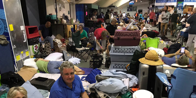 Gretchen Summer, 79, and her son, Dave Payson, 52, take shelter from Hurricane Irma inside the Germain Arena in Estero, Florida, U.S. September 9, 2017. REUTERS/Robin Respaut