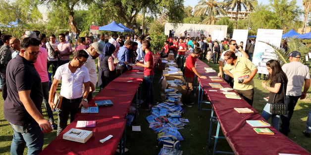 Iraqis attend the 'I'm Iraqi, I Read' cultural festival at Abu Nawas street, along the Tigris river in the capital Baghdad, on September 9, 2017.It's far from the image most have of the Iraqi capital-- but for one day this weekend on the banks of the Tigris, Iraqi readers were able to find some respite from the country's violence in the simple joy of losing themselves in a book. / AFP PHOTO / SABAH ARAR (Photo credit should read SABAH ARAR/AFP/Getty Images)