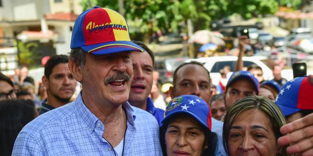 Former Mexican president Vicente Fox (L), named by the Venezuelan opposition as an observer to the opposition-organized vote to measure public support for Venezuelan President Nicolas Maduro's plan to rewrite the constitution, is pictured at a polling station in Caracas on July 16, 2017.Authorities have refused to greenlight the vote that has been presented as an act of civil disobedience and supporters of Maduro are boycotting it. Protests against Maduro since April 1 have brought thousands to