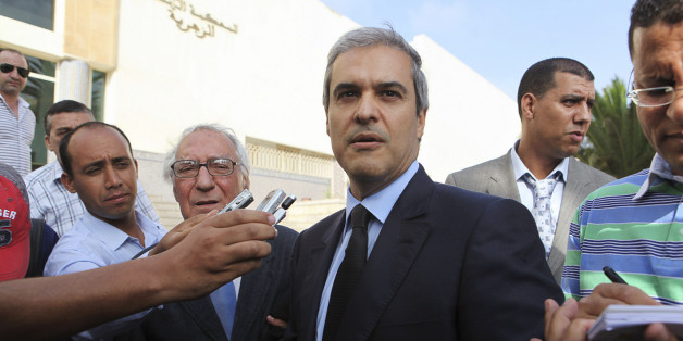 Prince Moulay Hicham, cousin of Morocco's King Mohammed VI, speaks to the press accompanied by his lawyer Abderrahim Berrada (centre L) after leaving the Ain Sebaa Court in Casablanca September 17, 2012. The Moroccan Prince has filed a lawsuit against Member of Parliament Abdelhadi Khairat on grounds of defamation. REUTERS/Macao (MOROCCO - Tags: ROYALS POLITICS CRIME LAW)