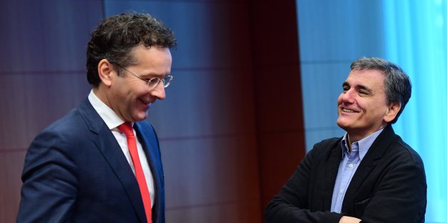 Eurogroup President and Dutch Finance Minister Jeroen Dijsselbloem (L) and Greece's Finance Minister Euclid Tsakalotos speak together ahead of a Eurogroup finance ministers meeting at the European Council in Brussels, on December 5, 2016. / AFP / EMMANUEL DUNAND (Photo credit should read EMMANUEL DUNAND/AFP/Getty Images)