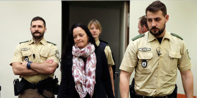 Defendant Beate Zschaepe (2nd L) arrives at a courtroom on September 12, 2017 in Munich, southern Germany.
German prosecutors sought life in jail for the surviving member of a German neo-Nazi trio accused of a string of racist murders that targeted mostly Turkish immigrants. Beate Zschaepe is co-accused in the 10 killings carried out by the other two members of the self-styled National Socialist Underground (NSU), Uwe Mundlos and Uwe Boehnhardt, between 2000 and 2007.
/ AFP PHOTO / dpa / Matthias Schrader / Germany OUT (Photo credit should read MATTHIAS SCHRADER/AFP/Getty Images)