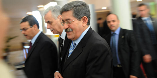 Algerian Prime Minister Ahmed Ouyahia (C) walks to the Algerian Parliament and Council of Nation to attend a special session on November 12, 2008 in Algiers. Algeria's parliament approved controversial constitutional amendments on November 12 which will allow veteran President Abdelaziz Bouteflika to serve a third term. A combined total of 500 members of the upper and lower houses of parliament approved the amendments to the former French colony's constitution while only 21 voted against. There