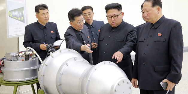 TOPSHOT - This undated picture released by North Korea's official Korean Central News Agency (KCNA) on September 3, 2017 shows North Korean leader Kim Jong-Un (C) looking at a metal casing with two bulges at an undisclosed location.
North Korea has developed a hydrogen bomb which can be loaded into the country's new intercontinental ballistic missile, the official Korean Central News Agency claimed on September 3. Questions remain over whether nuclear-armed Pyongyang has successfully miniaturised its weapons, and whether it has a working H-bomb, but KCNA said that leader Kim Jong-Un had inspected such a device at the Nuclear Weapons Institute. / AFP PHOTO / KCNA VIA KNS / STR / South Korea OUT / REPUBLIC OF KOREA OUT ---EDITORS NOTE--- RESTRICTED TO EDITORIAL USE - MANDATORY CREDIT 'AFP PHOTO/KCNA VIA KNS' - NO MARKETING NO ADVERTISING CAMPAIGNS - DISTRIBUTED AS A SERVICE TO CLIENTS
THIS PICTURE WAS MADE AVAILABLE BY A THIRD PARTY. AFP CAN NOT INDEPENDENTLY VERIFY THE AUTHENTICITY, LOCATION, DATE AND CONTENT OF THIS IMAGE. THIS PHOTO IS DISTRIBUTED EXACTLY AS RECEIVED BY AFP. / (Photo credit should read STR/AFP/Getty Images)