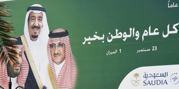 A picture taken on June 6, 2017 shows a poster of Saudi King Salman (C), Crown Prince and Interior Minister Mohammed bin Nayef (R) and Deputy Crown Prince and Defence Minister Mohammed bin Salman placed on on the offices of the Saudi national airline carrier in Riyadh.Arab nations including Saudi Arabia and Egypt cut ties with Qatar accusing it of supporting extremism, in the biggest diplomatic crisis to hit the region in years. / AFP PHOTO / FAYEZ NURELDINE (Photo credit should read FAYE