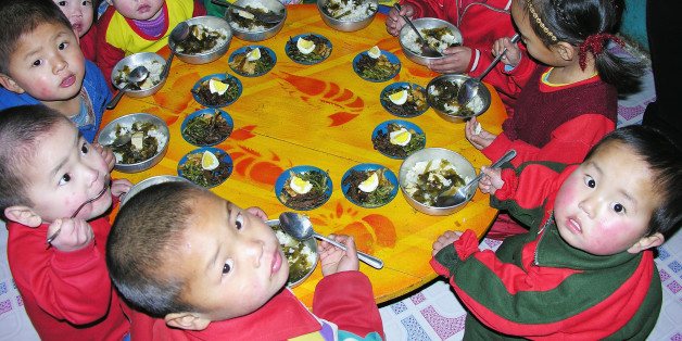 PYONGAN, NORTH KOREA - FEBRUARY 21: North Korean children eat lunch, including rice, provided by the United Nations World Food Programme, at a nursery on February 21, 2005 in Yomju county, North Pyongan province in North Korea. The WFP and UNICEF have stated that while child malnutrition rates in North Korea fell during the last two years, continued international assistance is needed to build on the gains. (Photo by Gerald Bourke/WFP via Getty Images)