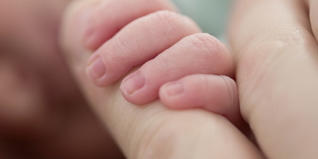 Close-up of newborn baby's hand. Photo by Lisa Wiltse (Photo by Lisa Wiltse/Corbis via Getty Images)